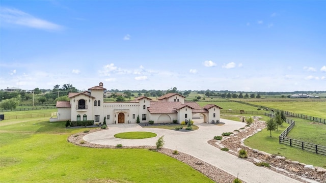 108 Country Vista Ln, Georgetown, TX 78626 - mediterranean / spanish home with curved driveway, stucco siding, a view of countryside, and a garage