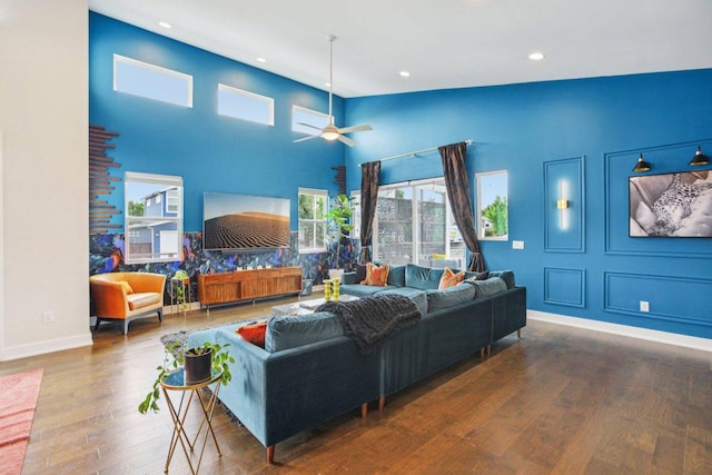 7000 Zachary Dr, Austin, TX 78724 - living room with wood finished floors, recessed lighting, ceiling fan, and a towering ceiling