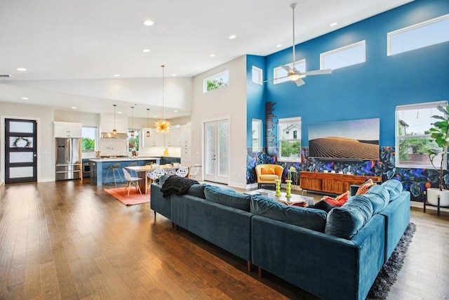 7000 Zachary Dr, Austin, TX 78724 - living room featuring a towering ceiling, dark wood-style flooring, ceiling fan, and recessed lighting