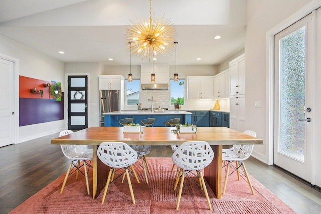7000 Zachary Dr, Austin, TX 78724 - dining space featuring dark wood-type flooring, healthy amount of natural light, recessed lighting, and a chandelier