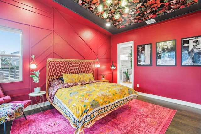 7000 Zachary Dr, Austin, TX 78724 - bedroom featuring a chandelier and wood finished floors