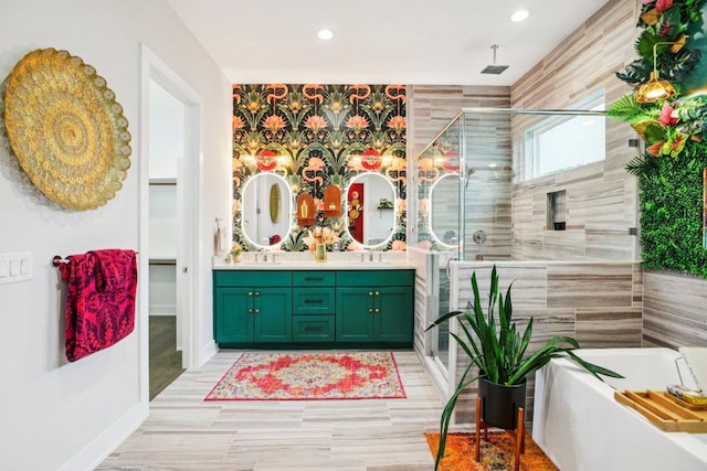 7000 Zachary Dr, Austin, TX 78724 - bathroom featuring a stall shower, double vanity, a bath, and recessed lighting