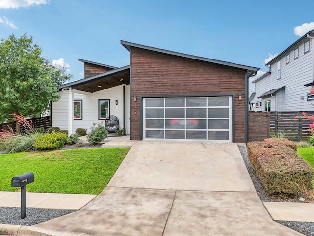 7000 Zachary Dr, Austin, TX 78724 - contemporary home with driveway and a garage
