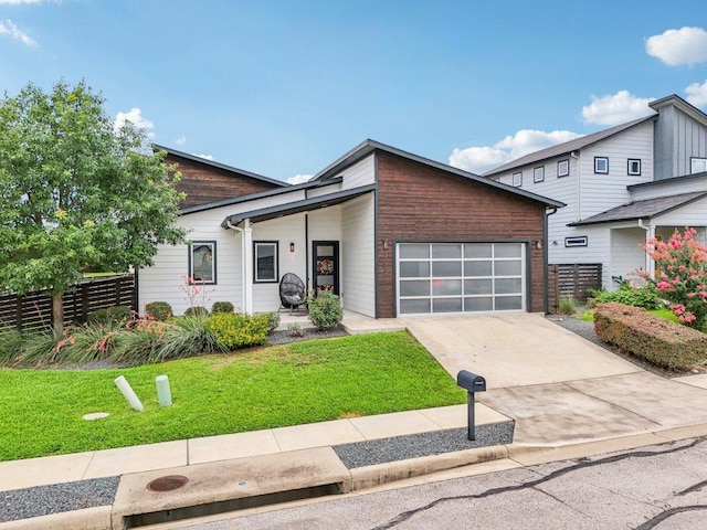 7000 Zachary Dr, Austin, TX 78724 - view of front facade featuring a garage and driveway