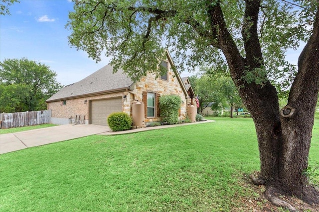 13 Mojave Ln, Belton, TX 76513 - view of front of house featuring a garage, stone siding, and driveway