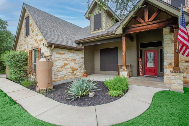 13 Mojave Ln, Belton, TX 76513 - view of front of house with stone siding, a shingled roof, and covered porch