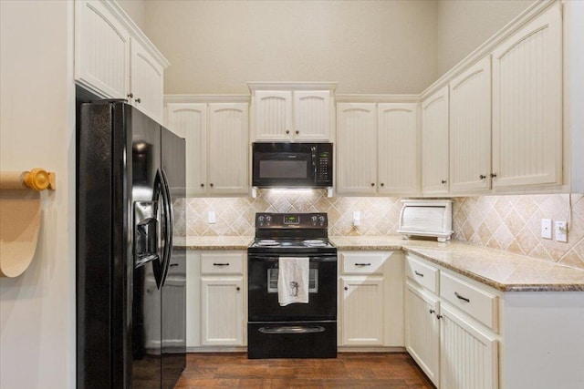 13 Mojave Ln, Belton, TX 76513 - kitchen with black appliances, backsplash, dark wood finished floors, and light stone counters