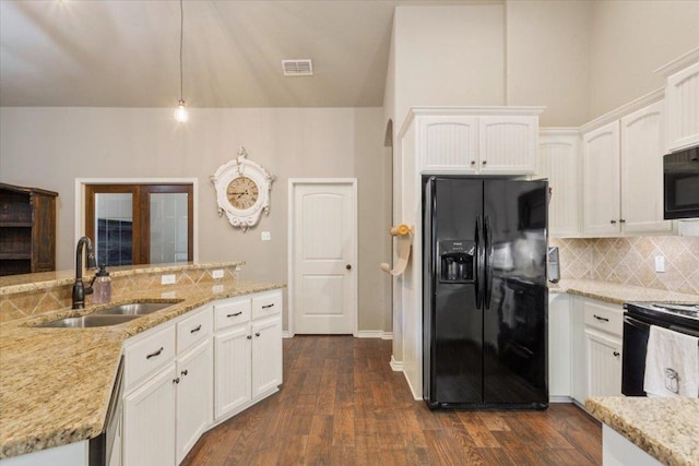 13 Mojave Ln, Belton, TX 76513 - kitchen featuring black appliances, decorative backsplash, white cabinetry, and dark wood-style floors