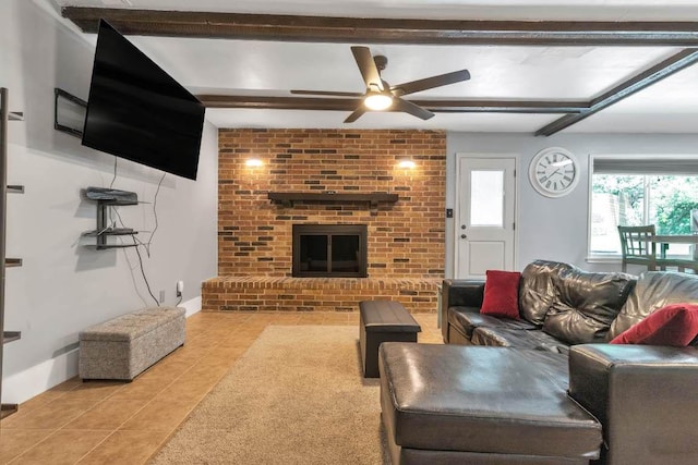 1102 Girard St, San Marcos, TX 78666 - tiled living room with ceiling fan, beam ceiling, and a fireplace