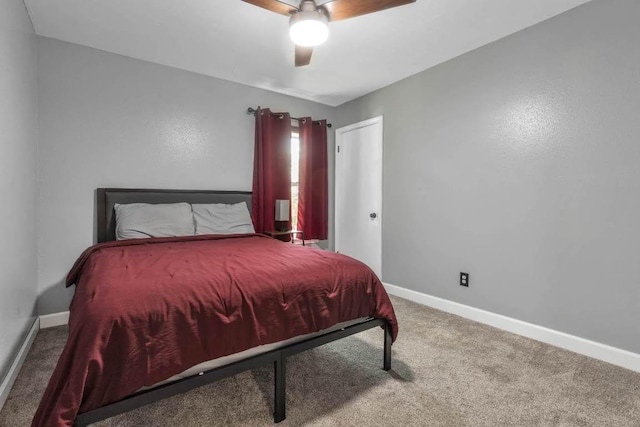 1102 Girard St, San Marcos, TX 78666 - carpeted bedroom with baseboards and a ceiling fan
