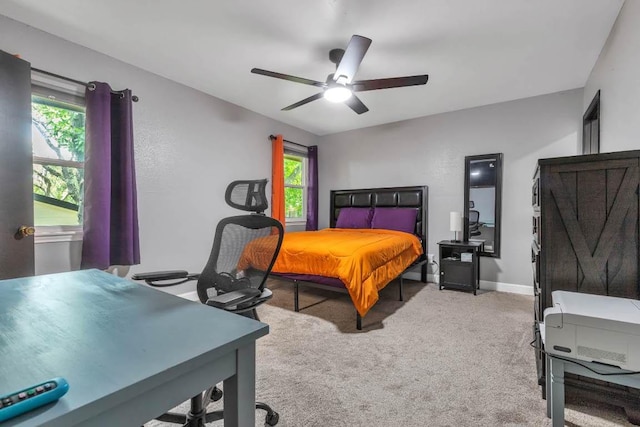 1102 Girard St, San Marcos, TX 78666 - carpeted bedroom with multiple windows, a desk, and ceiling fan
