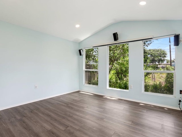 3811 Byron Dr, Austin, TX 78704 - empty room with vaulted ceiling, dark wood-type flooring, and recessed lighting