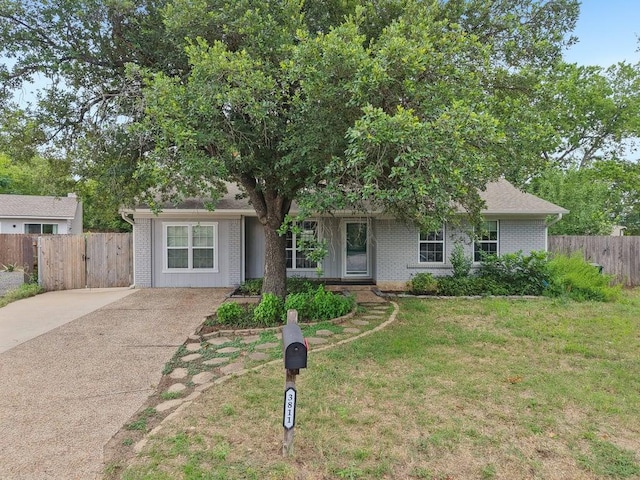 3811 Byron Dr, Austin, TX 78704 - view of front of property featuring brick siding, driveway, and a gate