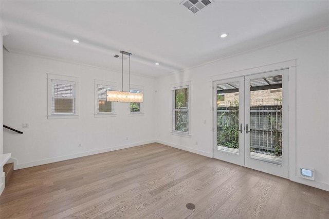 1403 W 12th St Unit B, Austin, TX 78703 - unfurnished dining area with light wood-style floors, stairway, recessed lighting, and crown molding