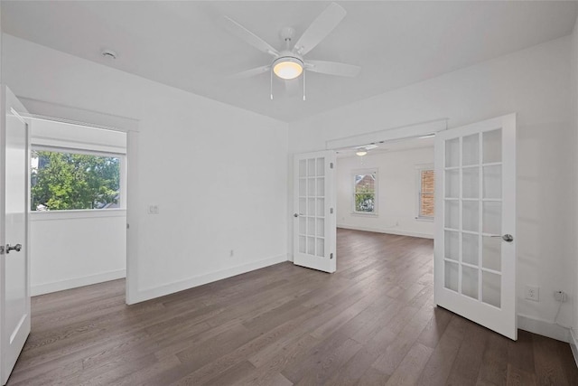 1403 W 12th St Unit B, Austin, TX 78703 - unfurnished room featuring french doors, dark wood finished floors, ceiling fan, and a smoke detector