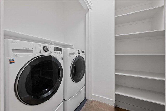1403 W 12th St Unit B, Austin, TX 78703 - laundry room featuring wood finished floors and washer and dryer