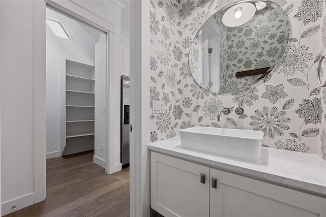 1403 W 12th St Unit B, Austin, TX 78703 - bathroom with wood finished floors and vanity
