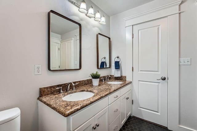 1117 Algarita Ave, Austin, TX 78704 - bathroom with double vanity and toilet