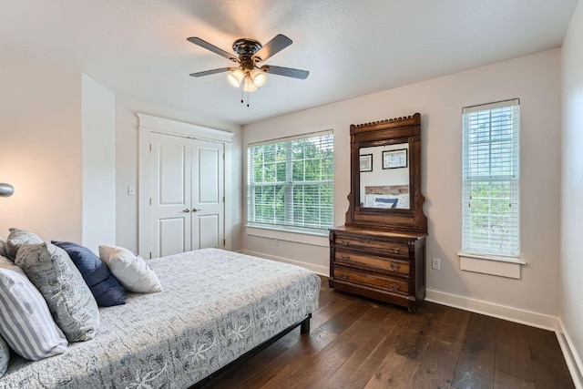 1117 Algarita Ave, Austin, TX 78704 - bedroom with dark wood-style floors, a closet, and ceiling fan