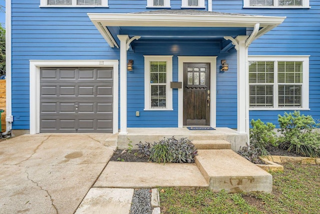 1117 Algarita Ave, Austin, TX 78704 - property entrance featuring driveway and an attached garage