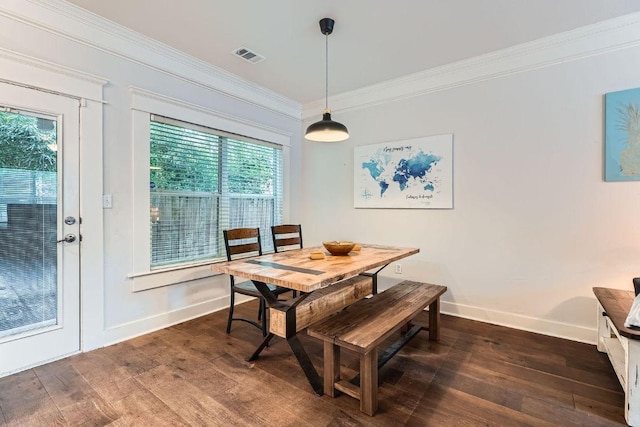 1117 Algarita Ave, Austin, TX 78704 - dining space featuring dark wood-type flooring, plenty of natural light, and crown molding