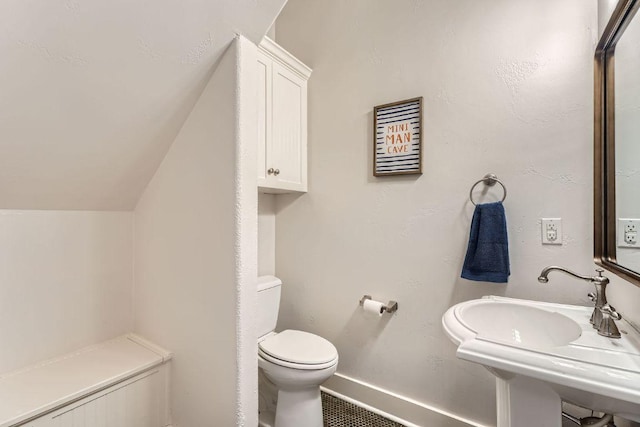 1117 Algarita Ave, Austin, TX 78704 - bathroom with toilet and lofted ceiling