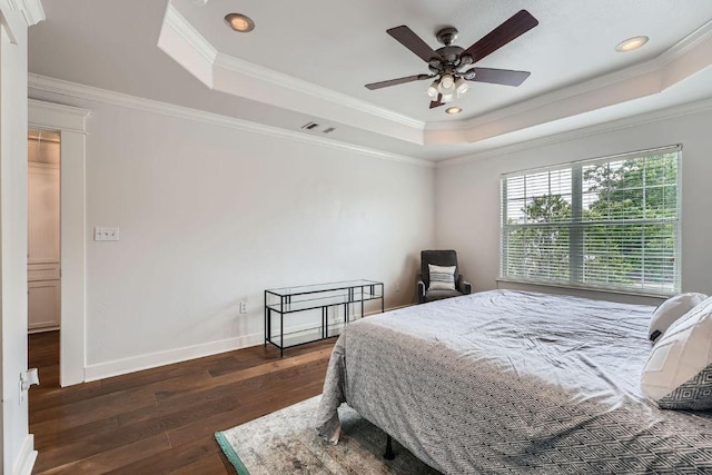 1117 Algarita Ave, Austin, TX 78704 - bedroom featuring a tray ceiling, dark wood-style flooring, crown molding, recessed lighting, and a ceiling fan