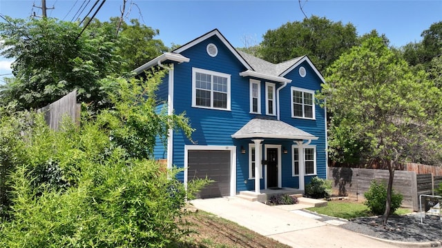 1117 Algarita Ave, Austin, TX 78704 - view of front of home with a garage, driveway, and roof with shingles