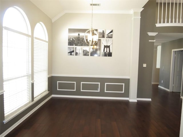 4008 Sable Oaks Dr, Round Rock, TX 78664 - unfurnished dining area with a chandelier, hardwood / wood-style floors, ornamental molding, lofted ceiling, and a wainscoted wall