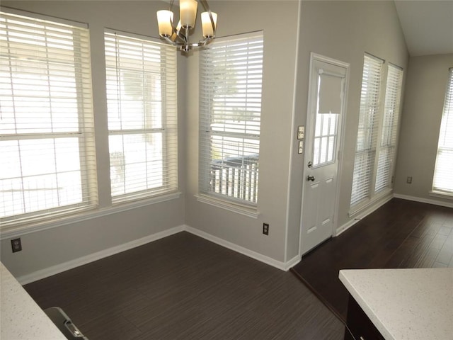 4008 Sable Oaks Dr, Round Rock, TX 78664 - unfurnished dining area with a chandelier, dark wood-type flooring, plenty of natural light, and lofted ceiling