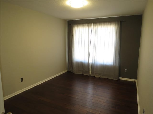4008 Sable Oaks Dr, Round Rock, TX 78664 - unfurnished room with dark wood-type flooring and baseboards