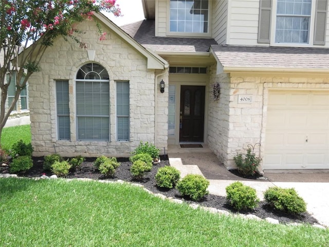 4008 Sable Oaks Dr, Round Rock, TX 78664 - property entrance with stone siding, a garage, and roof with shingles