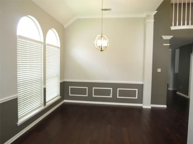 4008 Sable Oaks Dr, Round Rock, TX 78664 - unfurnished dining area with wood finished floors, a chandelier, vaulted ceiling, decorative columns, and ornamental molding
