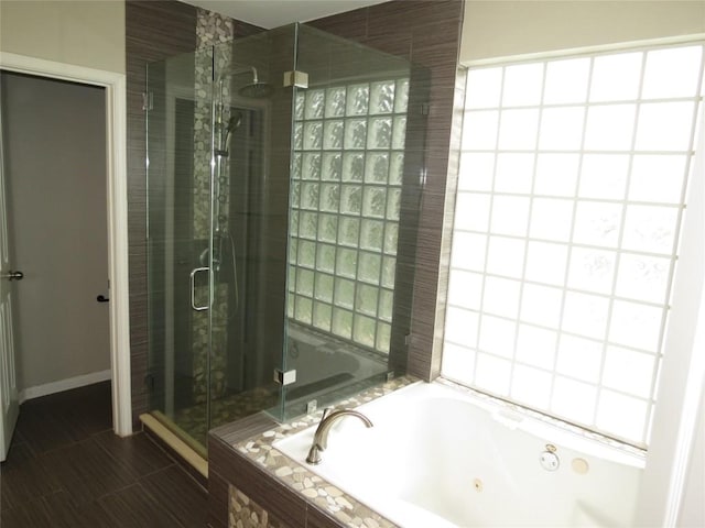 4008 Sable Oaks Dr, Round Rock, TX 78664 - bathroom featuring a stall shower and a tub with jets