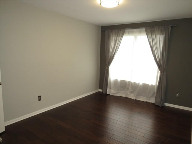 4008 Sable Oaks Dr, Round Rock, TX 78664 - empty room featuring dark wood-style floors and baseboards