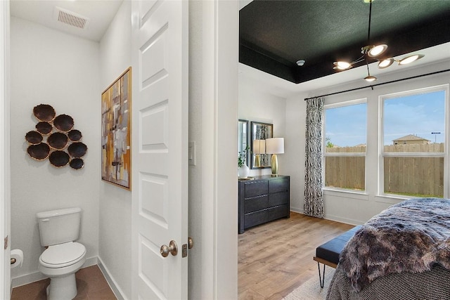 13613 Thomas Wheeler Way, Manor, TX 78653 - bedroom with baseboards and light wood-type flooring