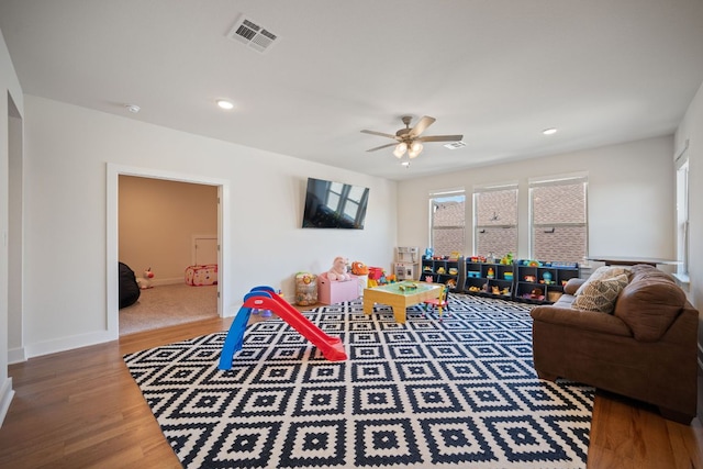 4628 Vieste Vw, Leander, TX 78641 - living room with wood finished floors, ceiling fan, and recessed lighting
