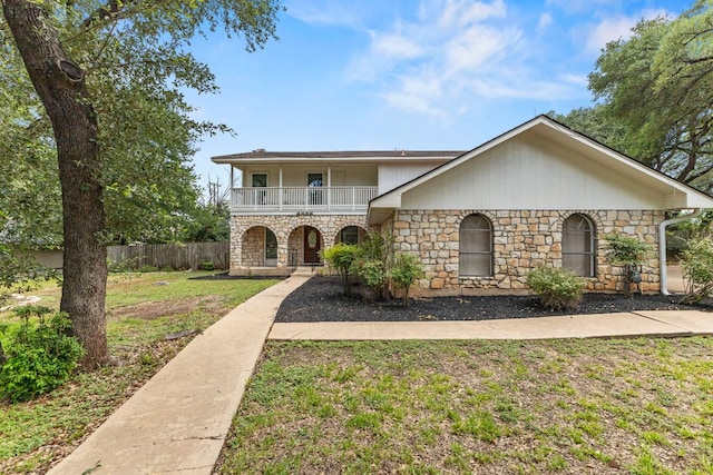 4003 Park Dr, Round Rock, TX 78681 - view of front facade featuring stone siding, a balcony, and covered porch