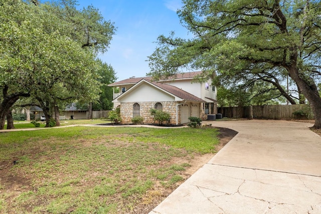 4003 Park Dr, Round Rock, TX 78681 - view of front of property with stone siding, driveway, and an attached garage