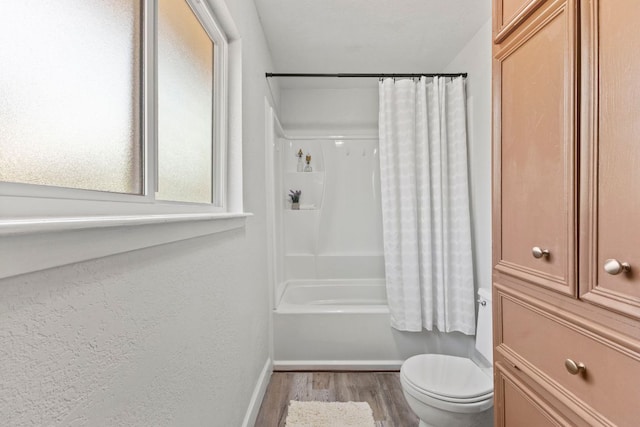 4003 Park Dr, Round Rock, TX 78681 - full bath with wood finished floors and shower / bath combination with curtain