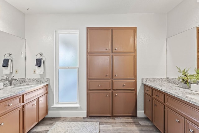 4003 Park Dr, Round Rock, TX 78681 - full bath featuring two vanities and wood finished floors