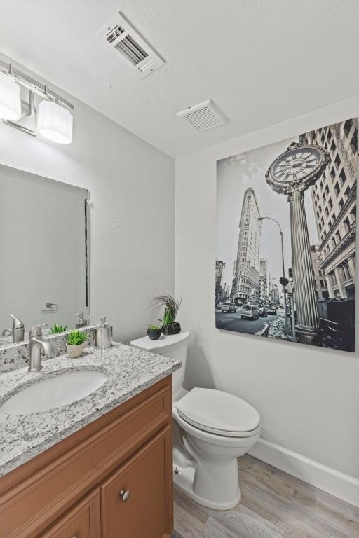 4003 Park Dr, Round Rock, TX 78681 - half bath with vanity and wood finished floors