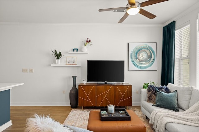 1900 Barton Springs Rd Unit 3038, Austin, TX 78704 - living area featuring wood finished floors, crown molding, and ceiling fan