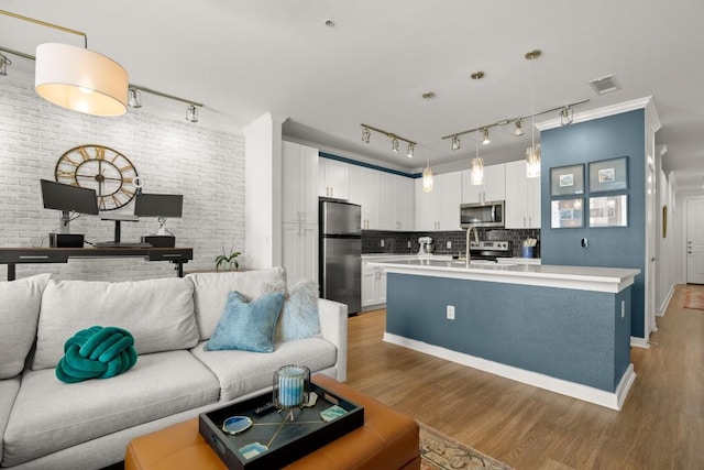1900 Barton Springs Rd Unit 3038, Austin, TX 78704 - living area featuring rail lighting and light wood finished floors