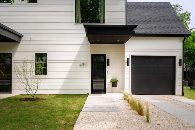 4911 Duval, Austin, TX 78751 - doorway to property featuring an attached garage, concrete driveway, and roof with shingles