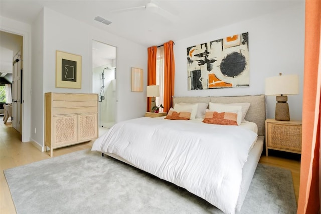 4911 Duval, Austin, TX 78751 - bedroom featuring wood finished floors and a ceiling fan