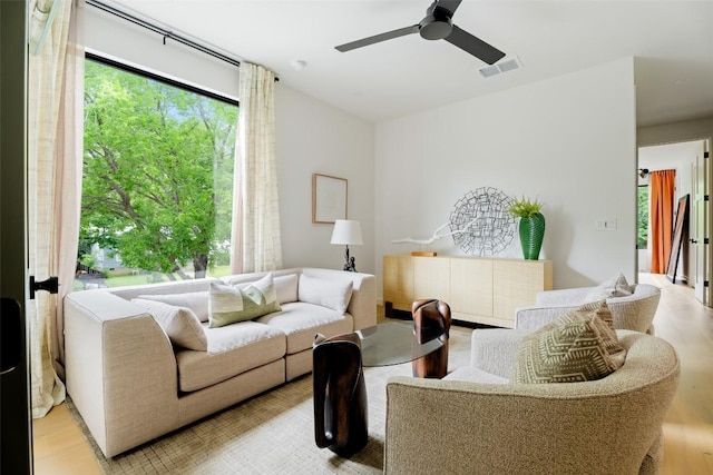 4911 Duval, Austin, TX 78751 - living area with light wood finished floors and a ceiling fan