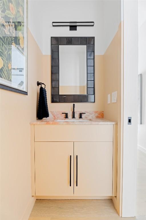 4911 Duval, Austin, TX 78751 - bathroom with vanity and wood finished floors