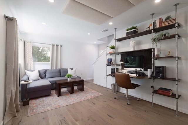 1303 Deloney St, Austin, TX 78721 - living area with wood finished floors, an office area, and recessed lighting