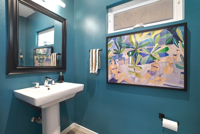 1303 Deloney St, Austin, TX 78721 - bathroom with a sink and baseboards